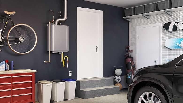 A garage with a black car, sports equipment, a red tool chest, recycling bins, a bicycle mounted on the wall, and an HVAC system installed next to a white door.