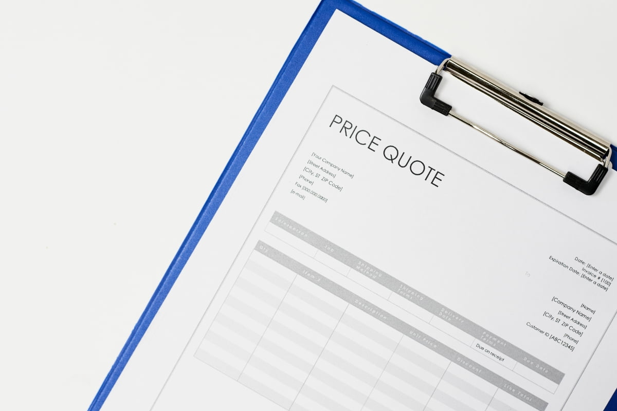 A clipboard holds a paper titled "Price Quote." The paper contains details, including a quote number, date, and empty tables for item descriptions and prices—essential tools for choosing the right HVAC contractor.